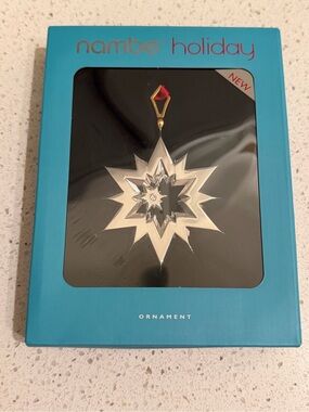 Nambe Silver Starburst Ornament with Gold and Red Accent